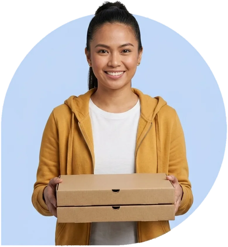 A delivery driver holding two pizza boxes, ready to hand them over.