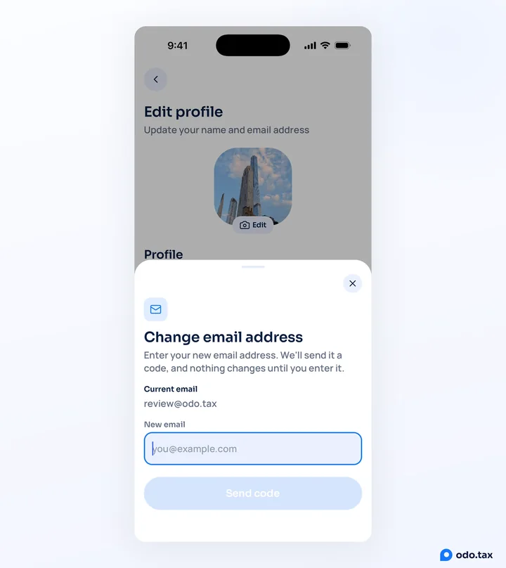 The Change email address sheet in odo on an iPhone: the current email, an empty New email field, and Send code.