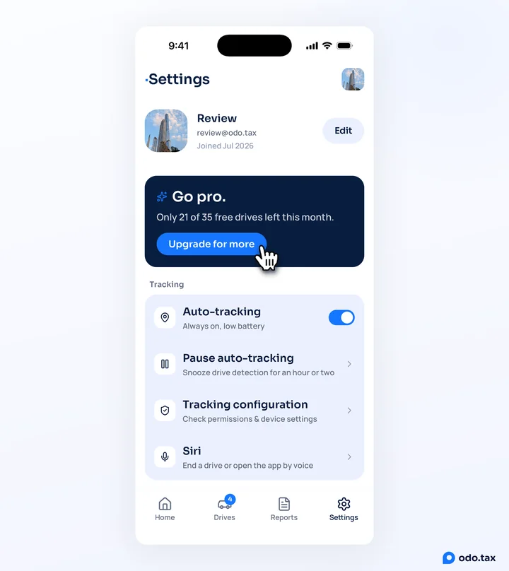The Settings tab in OdoTax on an iPhone with the Go pro card: Only 21 of 35 free drives left this month, and the hand on Upgrade for more.