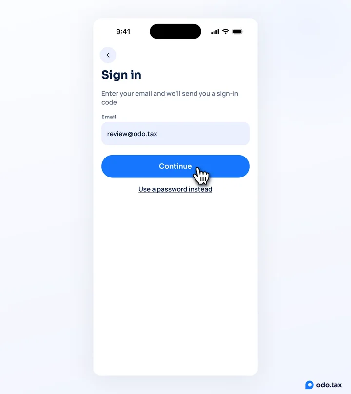 The Sign in screen on an iPhone: the email typed in, the hand on Continue, and Use a password instead below it.